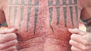 Playing with my nipples at the beach