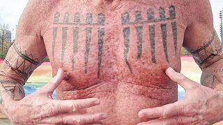 Playing with my nipples at the beach