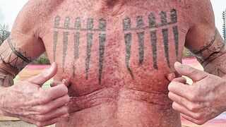 Playing with my nipples at the beach