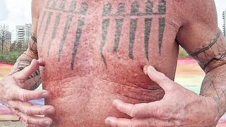 Playing with my nipples at the beach