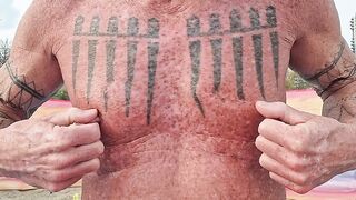 Playing with my nipples at the beach