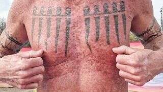 Playing with my nipples at the beach