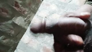 Gay guy spanking his cock in the bathroom