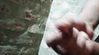 Gay guy spanking his cock in the bathroom