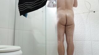 Hot gay man taking long and hot shower