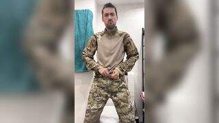 Military guy two hands jerks his meat