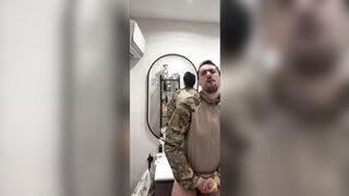 Military guy two hands jerks his meat