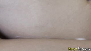 Watch this Asian twink get drenched in cum