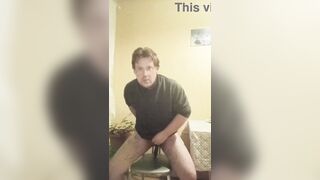 A tattooed gay man in glasses is riding a cucumber!