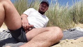 Beach Jerk off Pt 2, bearded guy cums on beach. - 2 image
