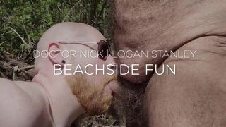 Daddy bear and ginger cub having some oral fun on the beach - 2 image