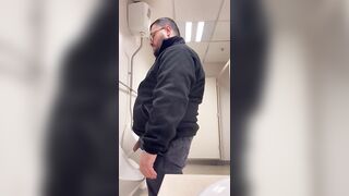 A Bull in a public toilet shooting a big load hoping to get caught. - 2 image
