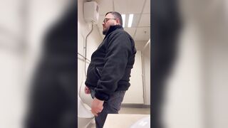 A Bull in a public toilet shooting a big load hoping to get caught. - 3 image