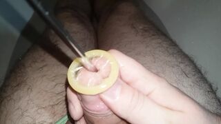 Rolling condom into urethra, urethral sounding, Close Up - 1 image